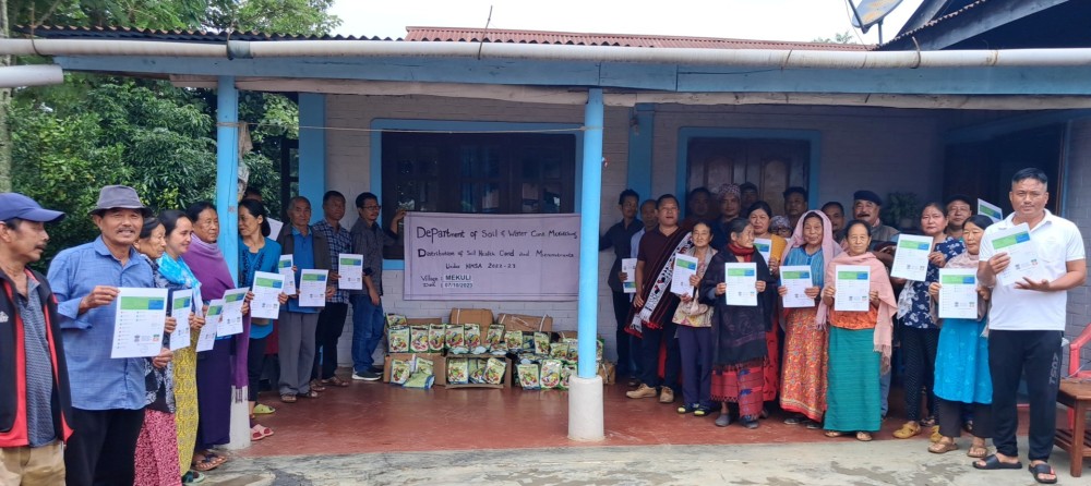Beneficiaries with officials and others during the distribution of Soil Health Cards and Micronutrients in Mekuli village on October 6.